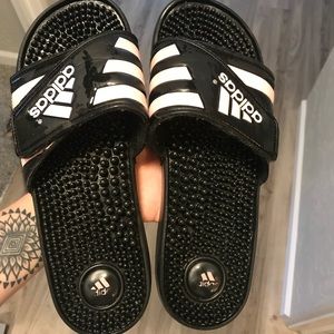 Black and pink adidas slides